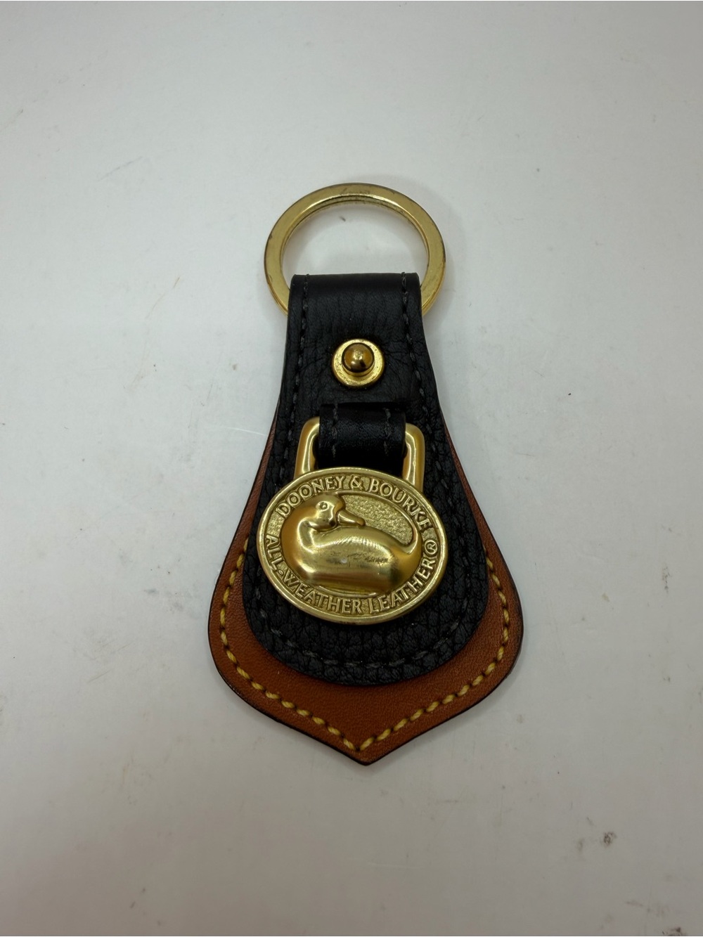Dooney & Bourke Black and Brown Leather Key Fob with Brass Duck Medallion